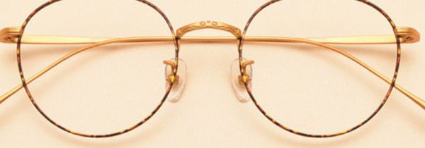 眼镜片掉了怎么按回去